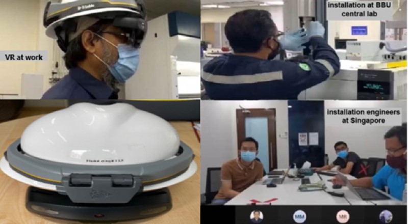 technical employee wearing VR headgear, workers in teams meeting  