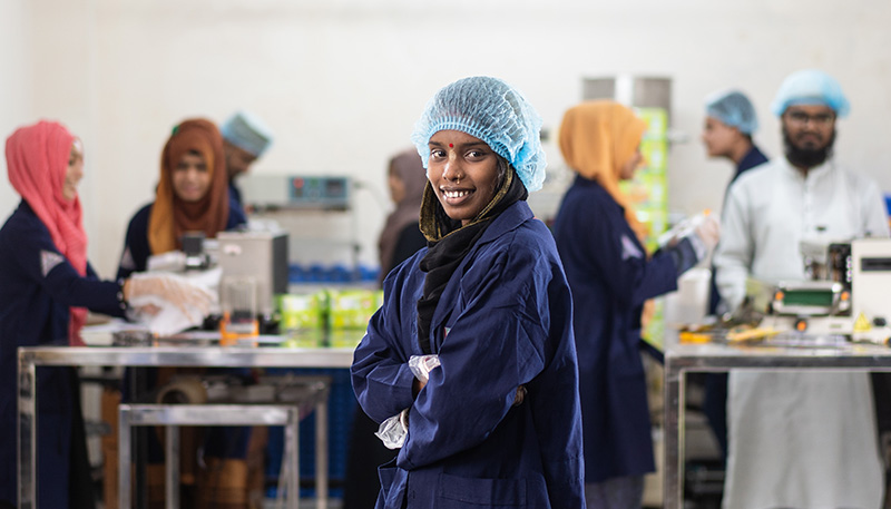 Employees wearing head coverings in a facility